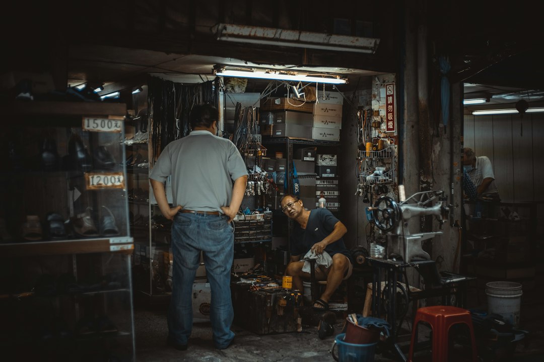 Two people working together in an automotive service shop